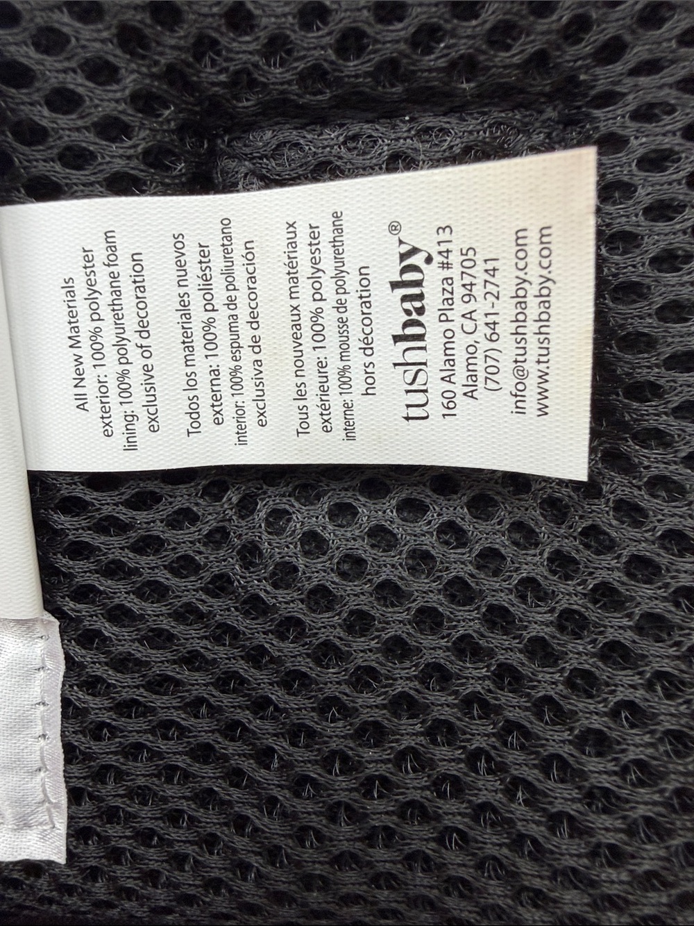 Tushbaby ergonomic hip carrier in black with gold hardware. Adjustable - Picture 8 of 9
